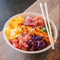 Instagram image of Lemonshark Poke Bowl with Fish and toppings from the side with chopsticks