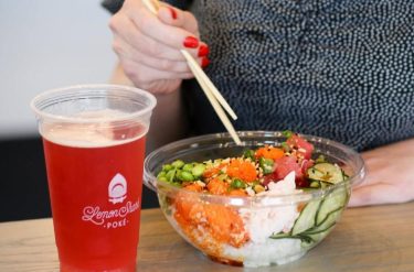poke for lunch Person enjoying poke bowl for lunch